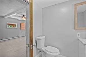 bathroom with toilet and ceiling fan