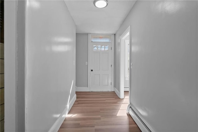 entryway featuring light hardwood / wood-style flooring and a baseboard heating unit