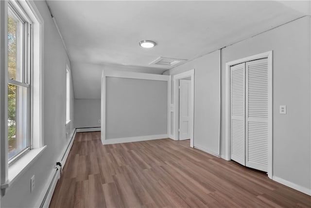 unfurnished bedroom featuring light hardwood / wood-style floors and multiple windows