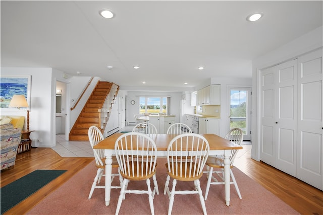 dining space featuring light hardwood / wood-style flooring and a wealth of natural light