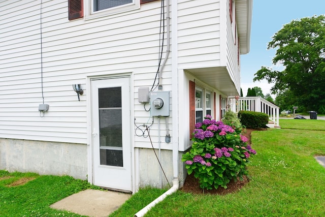 doorway to property featuring a yard