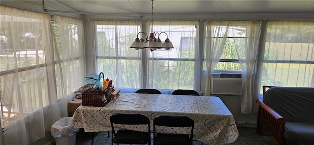 dining space featuring carpet floors, cooling unit, a notable chandelier, and plenty of natural light