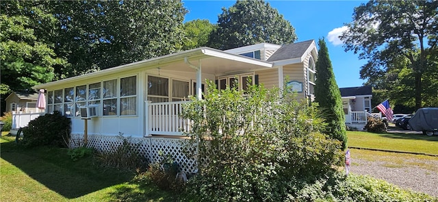 view of property exterior with a lawn