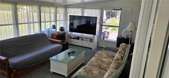 living room with lofted ceiling and dark carpet