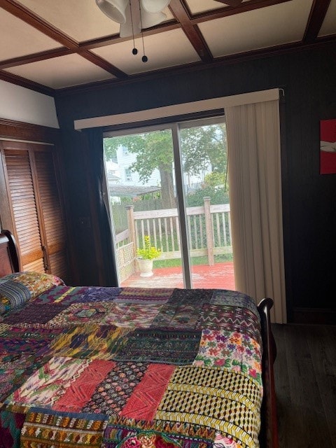 bedroom featuring ornamental molding, coffered ceiling, ceiling fan, and hardwood / wood-style flooring