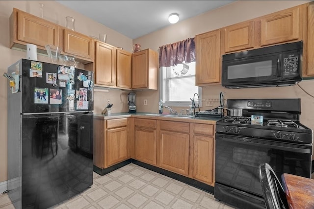 kitchen featuring sink and black appliances