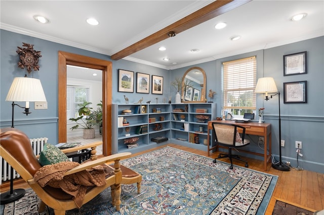 office space with ornamental molding, beam ceiling, and hardwood / wood-style floors