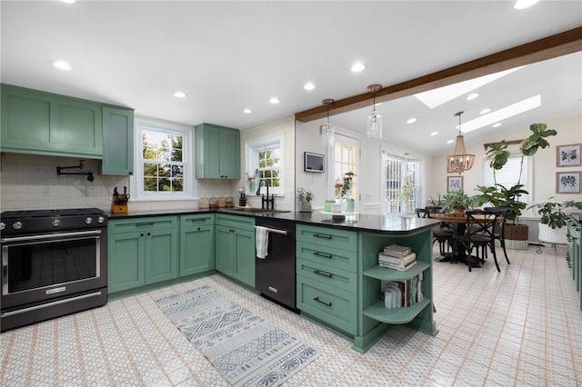 kitchen featuring electric stove, green cabinetry, hanging light fixtures, and sink