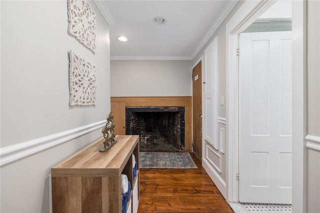 corridor with ornamental molding and dark hardwood / wood-style floors