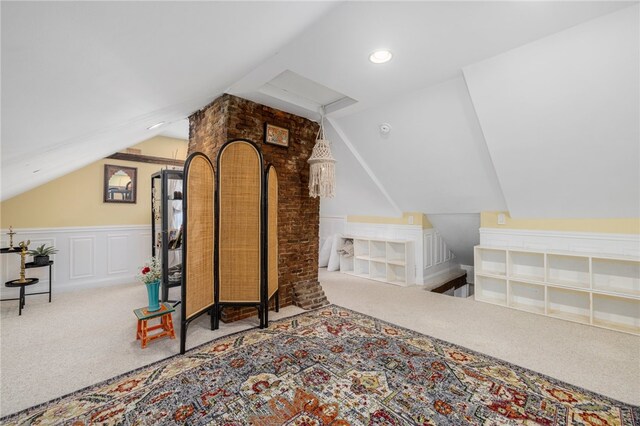 additional living space with carpet and vaulted ceiling