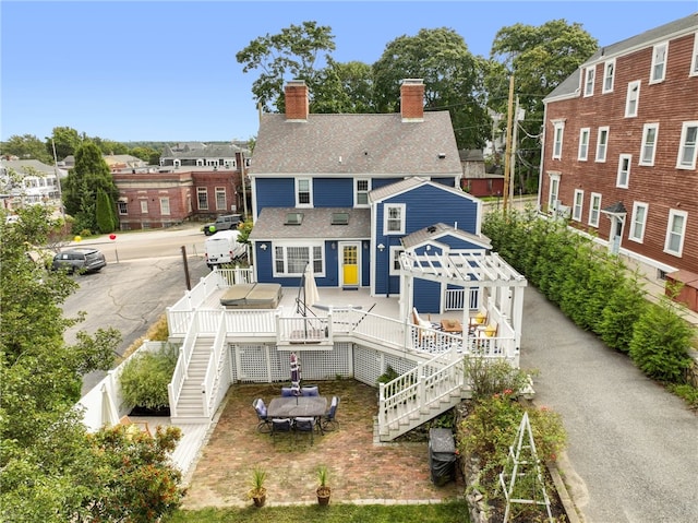 rear view of property with a deck