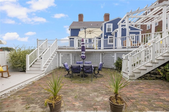 view of patio with a pergola and a wooden deck