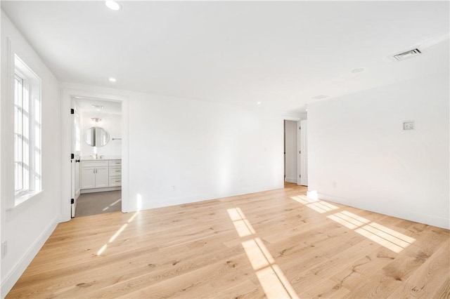 unfurnished room featuring light hardwood / wood-style floors