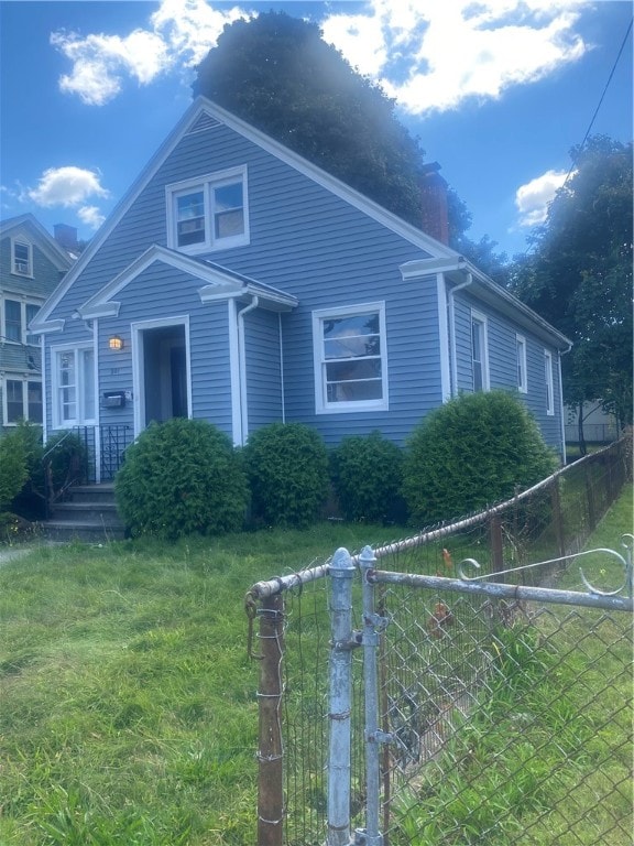 view of front of home with a front lawn