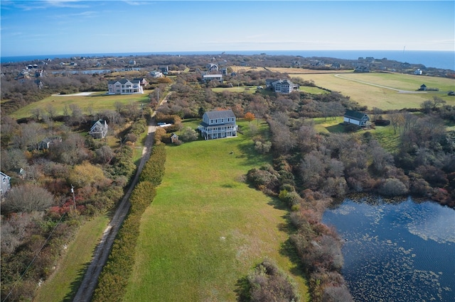 birds eye view of property with a water view and a rural view