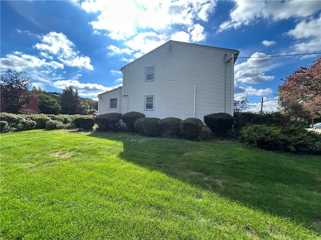 view of property exterior featuring a yard