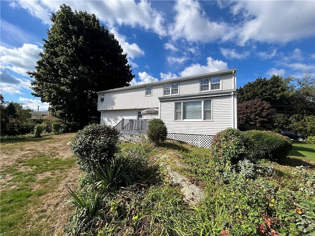 view of front of property with a wooden deck