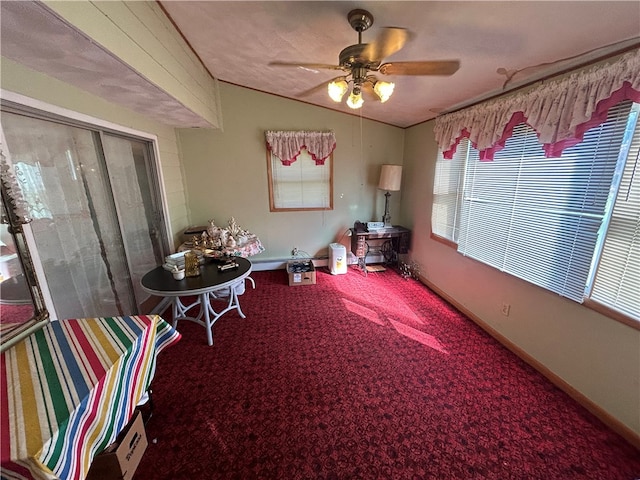 sunroom featuring vaulted ceiling and ceiling fan