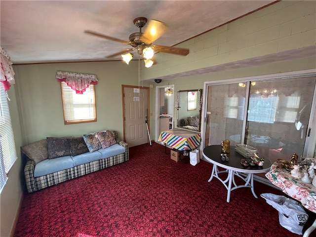 living room featuring carpet flooring, vaulted ceiling, and ceiling fan