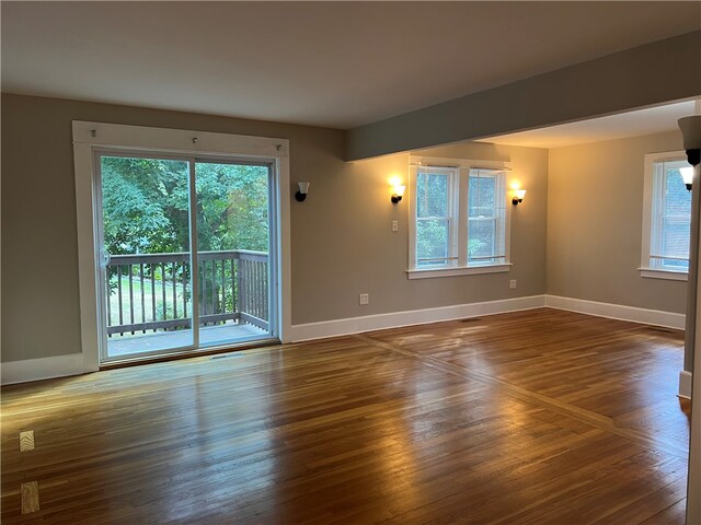 empty room featuring dark wood-type flooring