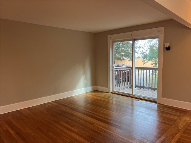 spare room with hardwood / wood-style floors