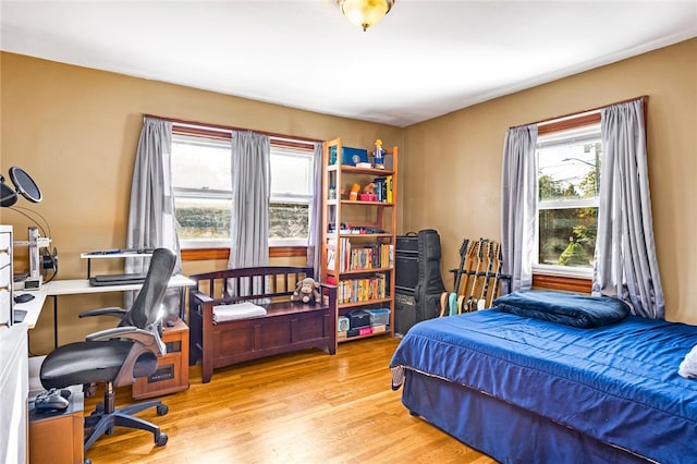 bedroom with light wood-type flooring