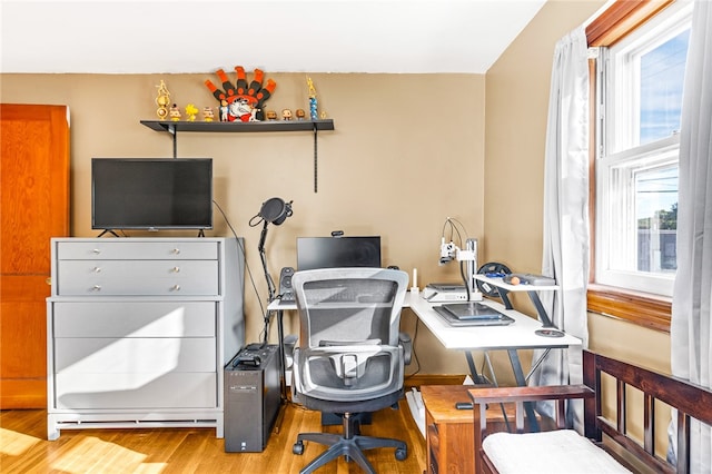 office area with hardwood / wood-style flooring and plenty of natural light