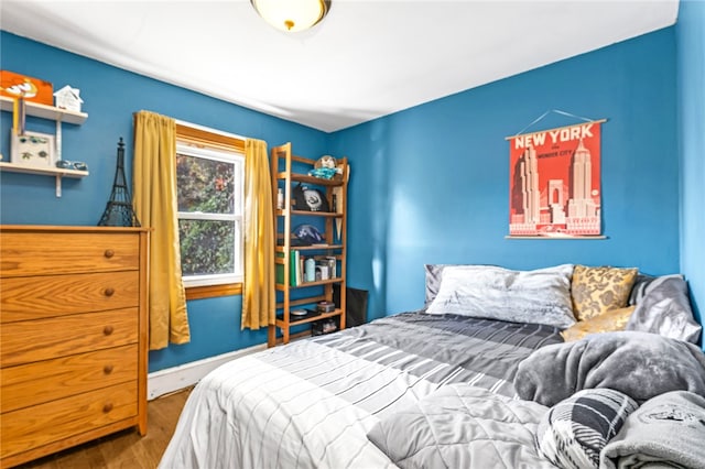 bedroom with hardwood / wood-style floors