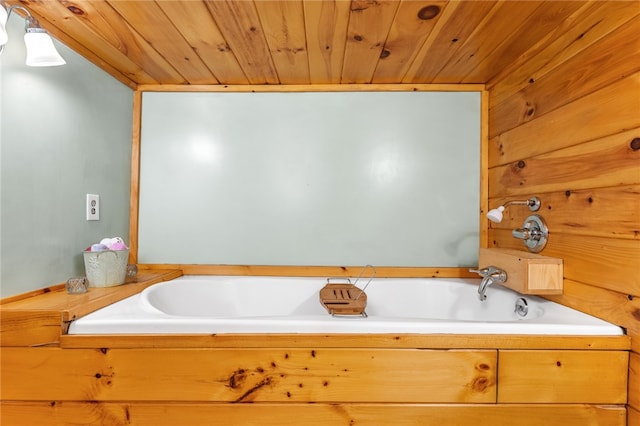 bathroom featuring wood ceiling and a bathtub