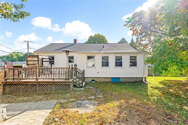 back of house featuring a deck