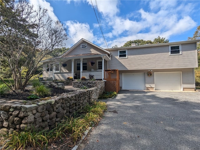 view of front of house with a garage and a porch