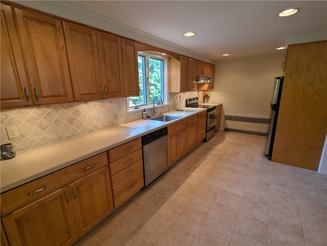 kitchen with radiator, light tile patterned flooring, sink, backsplash, and stainless steel appliances