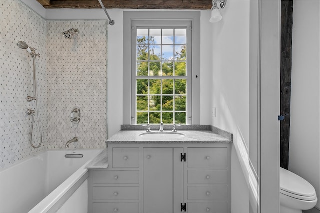 full bathroom with tub / shower combination, vanity, and toilet