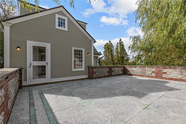 rear view of house featuring a patio