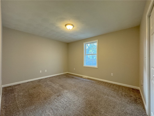 unfurnished room with carpet floors