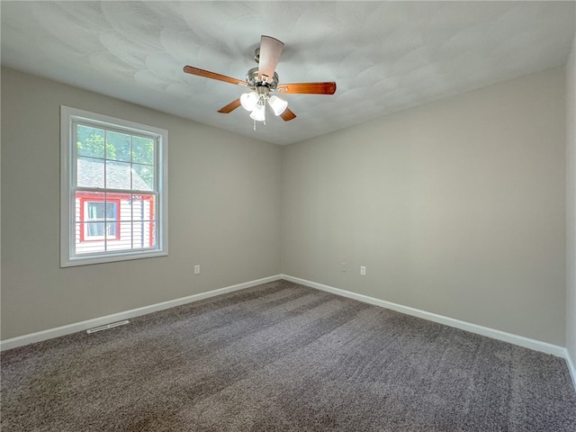 spare room featuring carpet and ceiling fan