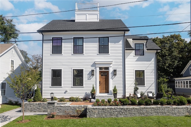 view of front of house featuring a front lawn