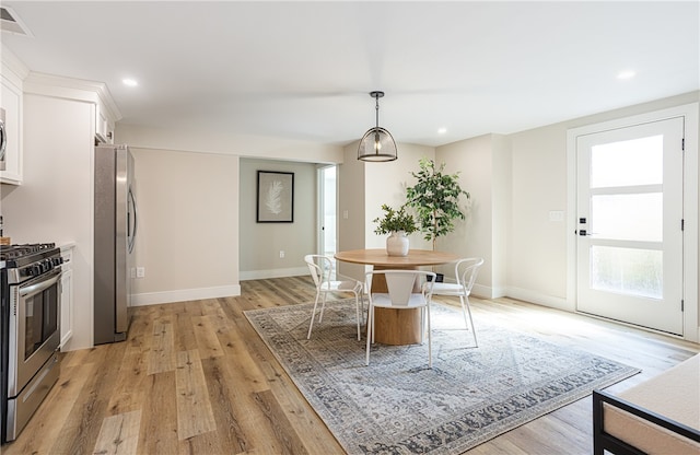 dining space featuring light hardwood / wood-style flooring