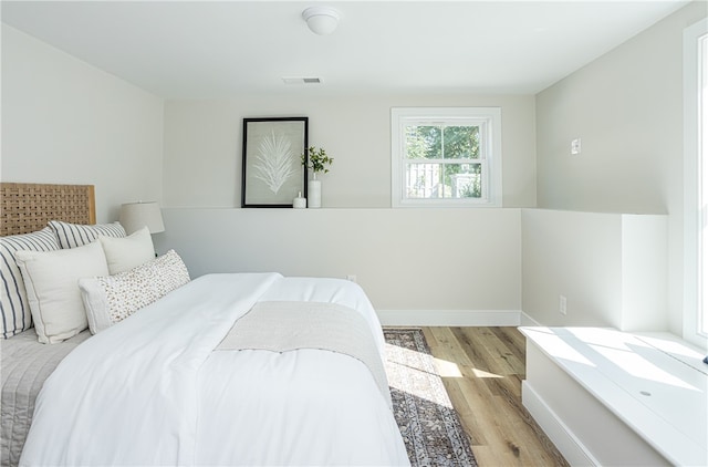 bedroom with light hardwood / wood-style flooring