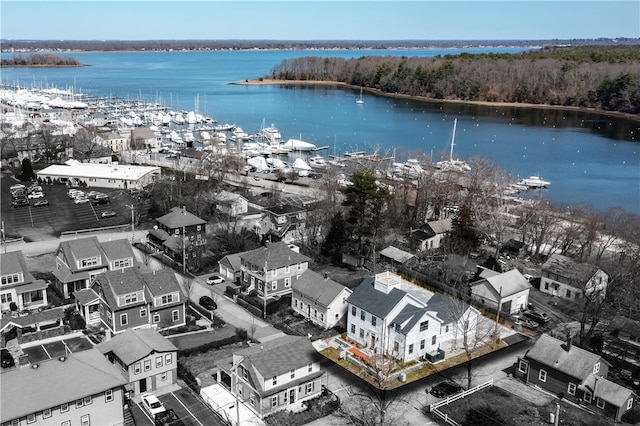 birds eye view of property with a water view