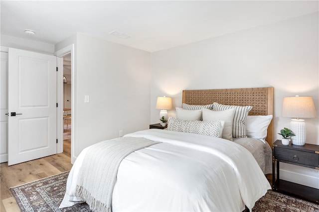 bedroom featuring wood-type flooring