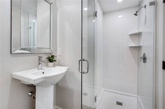 bathroom with a shower with shower door