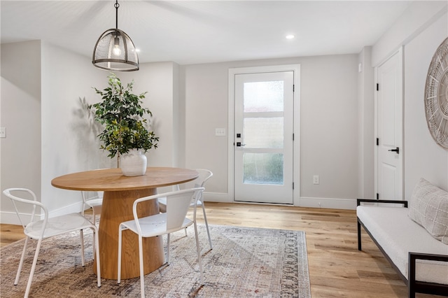 unfurnished dining area featuring light hardwood / wood-style flooring