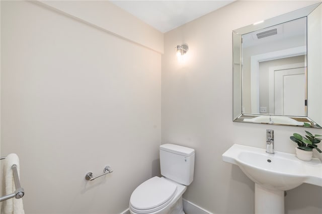 bathroom with sink and toilet