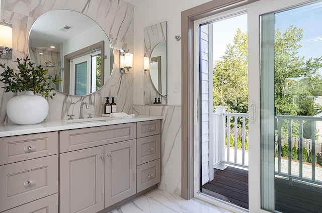 bathroom featuring tile walls and vanity