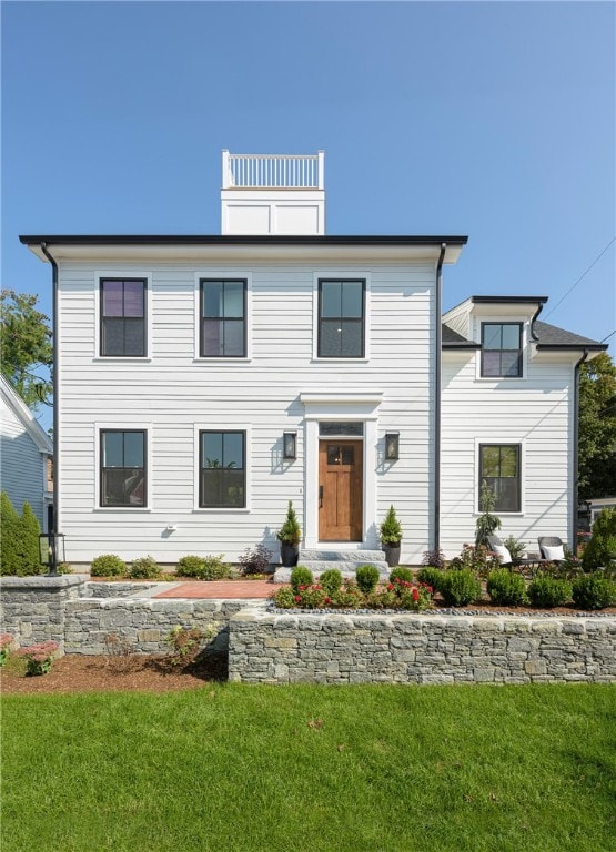 view of front of home with a front yard