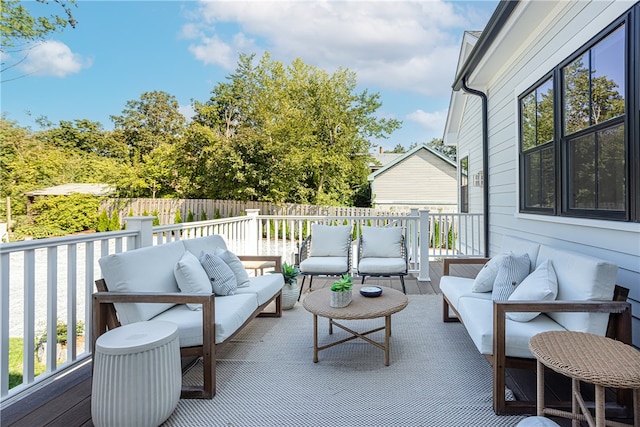 wooden deck featuring an outdoor living space