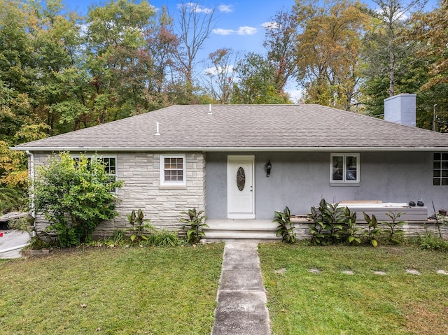 view of front of home featuring a front lawn