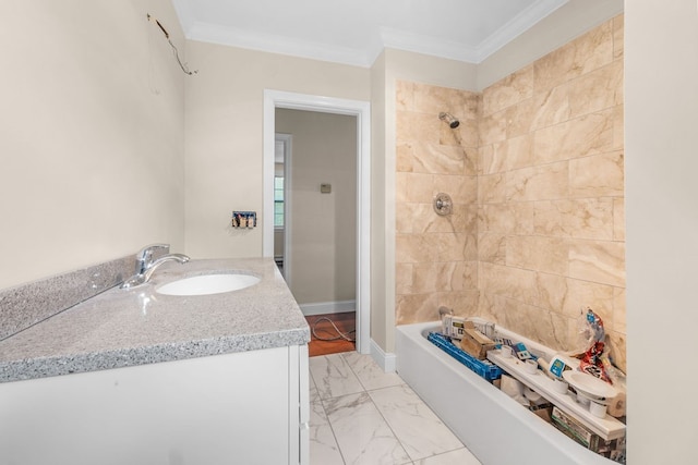 bathroom with tiled shower / bath combo, vanity, and crown molding