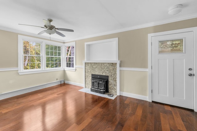 unfurnished living room featuring ornamental molding, wood-type flooring, a wood stove, and ceiling fan